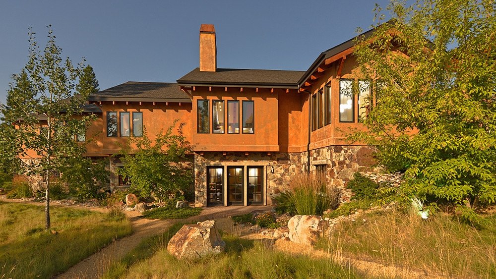 Rammed earth and stone home at sunset, Carmel California