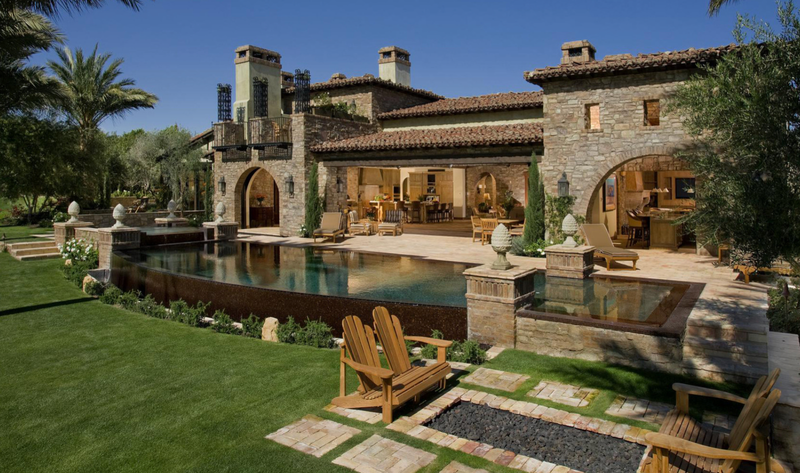 Tuscan stone estate with arched loggia and lap pool, San Diego California