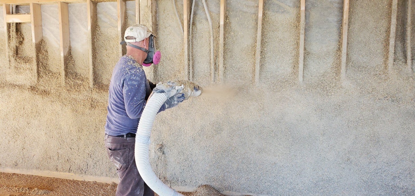 Craftsman working with natural building materials